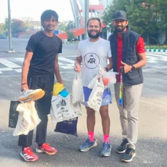With a fellow coach who helped collect and distribute running gear to young athletes. It takes a community to build champions, and I am grateful for the support.