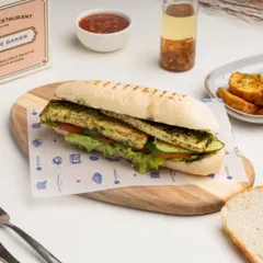 Another view of the Grilled Paneer Panini, showcasing the perfectly grilled bread and fresh ingredients.
