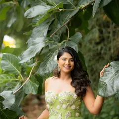 A smiling, happy portrait surrounded by nature. The soft, diffused sunlight is perfect for creating flattering and natural-looking skin tones.
