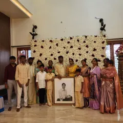 A family gathers around the memorial portrait of their loved one. It is a profound honor to create art that brings families together to celebrate a life.