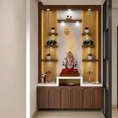 This pooja unit combines open shelving with closed storage. The design is highlighted by a backlit peacock feather motif and provides ample space for a central idol and smaller decorative items.