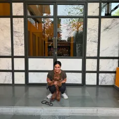 Theo posing in front of our center. He learned foundational skills that will last a lifetime.