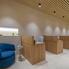 This is the main workstation area from 'The Terra Office'. I focused on creating a warm, uncluttered, and productive environment using natural wood tones, a fluted ceiling for texture, and clean, modern lines.