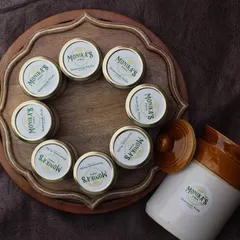 A beautiful overhead view of my homemade pickle jars, ready to bring a taste of summer to your table. Each jar is a small batch, made with care to ensure the best quality and flavor.