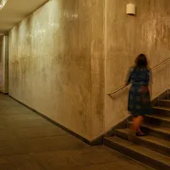 The play of light on the textured walls of a staircase creates a sense of movement and artistry. I believe every part of a building should be a sensory experience.