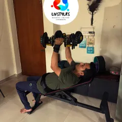 This client is performing an incline dumbbell press, which targets the upper chest and shoulders. We use adjustable dumbbells to progressively increase the challenge as he gets stronger.