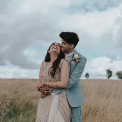 The joy of a wedding day captured in the beautiful English countryside. This image reflects our ability to shoot in diverse international locations, capturing candid happiness and natural romance.