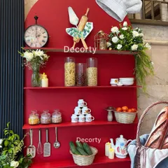 Here is a closer look at the detailed prop styling for the Masterchef theme. I use a mix of real ingredients like pasta and cucumbers with decorative items like a vintage clock and stacked teacups to create a rich, visually interesting display.