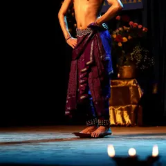 The foundation of Kuchipudi is its intricate footwork, or 'Aḍugulu'. This photo focuses on the dancer's stance and the ghungroo (ankle bells) that give rhythm to every step.