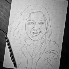 The first step is always a precise outline using the grid method. This ensures all the proportions are accurate before I begin the detailed shading work.
