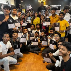 A picture of success. Our graduates proudly display their globally recognized certificates. This day marks a major milestone, and our lifetime support ensures it's just the beginning of their journey in the glam industry.