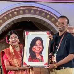 The joy on a person's face when they receive their caricature is the best part of my job. I had the honor of presenting a framed portrait to the wonderful singer Malini Awasthi ji on stage at the Timeless Ayodhya Festival.