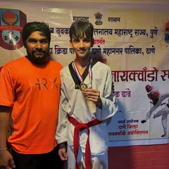 Here is another one of our dedicated students with his well earned medal at the district level Taekwondo competition. His focus during the event was excellent.