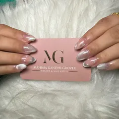 A stunning example of cat eye nail extensions. This design uses magnetic polish to create a shimmering, light-reflecting effect, finished with a glossy top coat for a truly eye catching look.