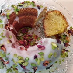 Here you can see a slice of the Gulab Jamun Cake, revealing the soft, moist texture inside. The cake soaks up the aromatic syrup beautifully, making every bite juicy and flavorful.
