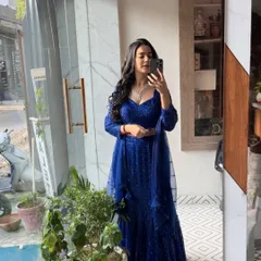 A quick mirror check in the sparkling blue lehenga. This shows my genuine excitement for the outfits I get to wear.