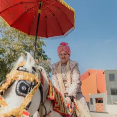 A groom from another culture fully embracing the traditions of an Indian wedding, seen here during the Baraat. We are there to document every vibrant and joyful moment of your fusion celebration.