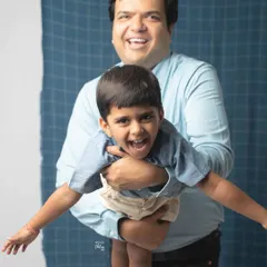 Look at that pure, unrestrained joy. A father playfully lifting his son creates a moment of pure energy and laughter that makes for an unforgettable photograph.