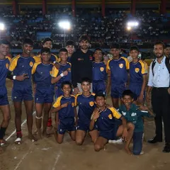 Our junior players on the mat after their win, soaking in the atmosphere of the stadium.