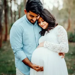 A classic, loving embrace surrounded by the beauty of nature. This outdoor couple's portrait is filled with warmth and tenderness.
