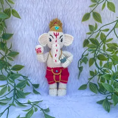 A detailed look at my Lord Ganesh doll. I carefully stitched the details on his trunk, the swastika on his hand, and his golden crown. He is a symbol of new beginnings and removing obstacles.