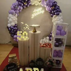 Make a milestone unforgettable with large light-up numbers and a name. This 50th birthday decor for 'APPA' makes the guest of honor the center of attention and creates a fantastic photo opportunity.
