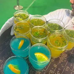 A tray of vibrant mocktails. We ensure our non-alcoholic options are just as creative and delicious as our cocktails.