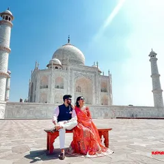 A picture-perfect moment on the iconic bench in front of the Taj Mahal. We guide couples into poses that feel natural and elegant, resulting in a timeless pre-wedding portrait.