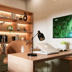 Functionality meets style in this executive office design. I focused on clean lines, integrated shelving with ambient lighting, and a clear view of the display screen, ensuring the space is as practical as it is aesthetically pleasing.