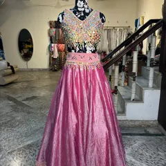 The full view of our mirror work lehenga. The vibrant pink is the new favorite for mehendi functions, a beautiful alternative to traditional yellows and greens.