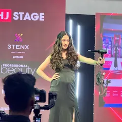 A throwback to slaying the stage at Professional Beauty India in Mumbai. Here, a model showcases a finished look on the runway, a culmination of live cutting and styling.
