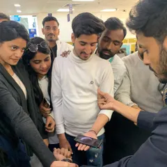 Using a guest's own phone for a modern magic trick. Incorporating personal items makes the illusion feel even more impossible and memorable for the spectator.
