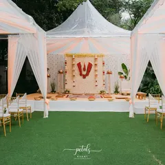 For this Telugu Nalugu ceremony, I designed a clean and sacred space under a tent. The mandap features a backdrop of white chrysanthemums with a prominent red Balaji Nama, creating a divine focal point for the rituals.