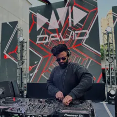 Commanding the stage at a massive Holi festival. My VDJ setup isn't just about music; it's a full visual experience with graphics synced to every beat, making the event truly epic.