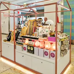 We fabricated this well-lit, professional jewelry kiosk for an exhibition at Seawood Mall. The design includes clean white cabinetry, rose gold framing with integrated LED lighting, and multiple display levels to showcase products effectively.