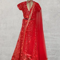 For those grand family weddings, I create outfits that are pure elegance. This stunning red lehenga choli features intricate embroidery and a timeless design, handcrafted to make your little girl feel like the star of the show.