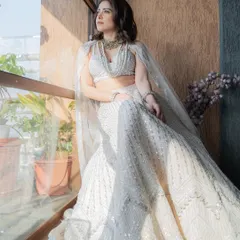I styled Nushrratt Bharuccha in this ethereal ivory lehenga by Disha Patil for a wedding. The layered pearl necklaces add a touch of modern royalty, making it a standout look for a wedding guest.