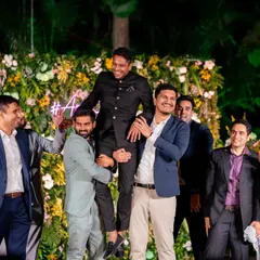 The classic groom lift by his friends. This is always a highlight of the groomsmen's performance and a great photo opportunity.