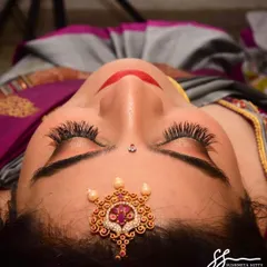A detailed shot of the eye makeup. I used long, fluttery lashes and a subtle shimmer on the lids to create this gorgeous and elegant look for her special day.