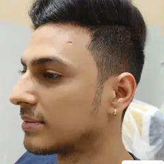 A profile view of the final haircut, highlighting the clean lines and modern look.