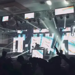 A silhouette shot of me against the massive LED screen and stage lights. Playing for a crowd this big is an incredible feeling.