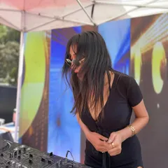 A candid shot of me enjoying a sunny day set. There's no place I'd rather be than behind the decks, sharing music with people.