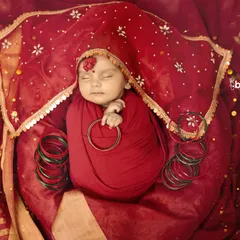 Welcoming a little devi during the sacred days of Navratri. I wrapped this precious newborn in auspicious red, complete with a tiny bindi and bangles, to create a portrait of pure divinity and peace.