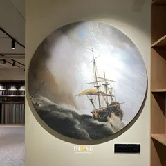 Your walls can be a canvas for epic storytelling. This circular tile mural captures the drama of a classic maritime painting, showcasing our ability to reproduce intricate and detailed art on a grand scale.