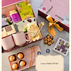 This Luxury Rakhi Gift Box is designed for the sibling who appreciates the finer things. It includes a mix of sweet treats like motichoor ladoo and pistachio brittle, paired with elegant ceramic mugs and a keepsake tray. It’s a modern, aesthetic take on a timeless tradition.