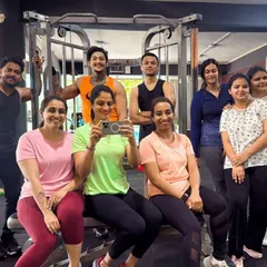 A typical post-workout scene: tired smiles and a sense of accomplishment. This is our gym family.