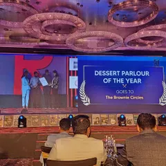 A proud moment for our team, accepting the award for "Dessert Parlour of the Year." This is a testament to our team's hard work and our customers' loyal support.