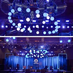 Lighting is key to creating a party atmosphere. This stage featured a dynamic installation of vertical light bars and a ceiling of spherical bulbs for a high-energy, concert-like feel.
