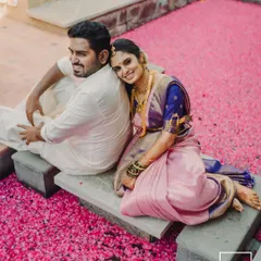 A romantic portrait of a couple resting on a bed of pink petals. This unique and artistic shot is a perfect example of how we create unforgettable images.