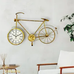 Our golden bicycle wall clock, shown here in a bright, modern living space. Its unique design is a conversation starter and adds a touch of personality to your decor.